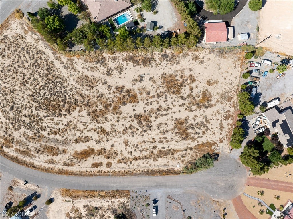 An aerial perspective showcases a spacious vacant parcel ready for custom development.