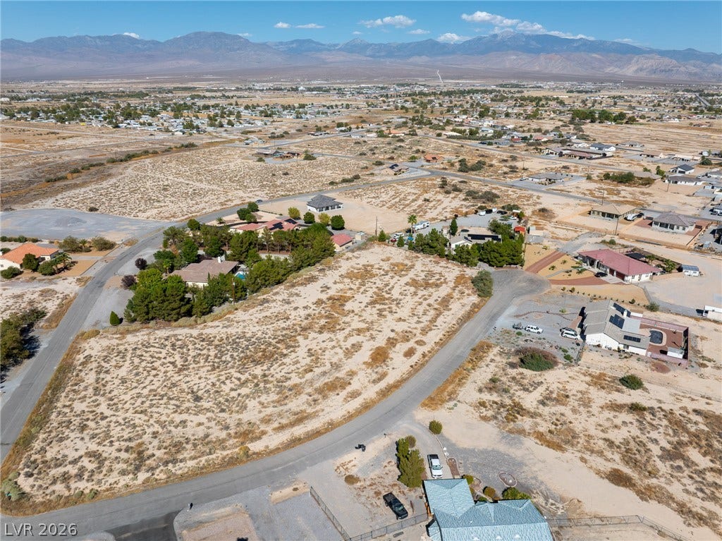 Panoramic mountain vistas frame this vast desert lot primed for future development.