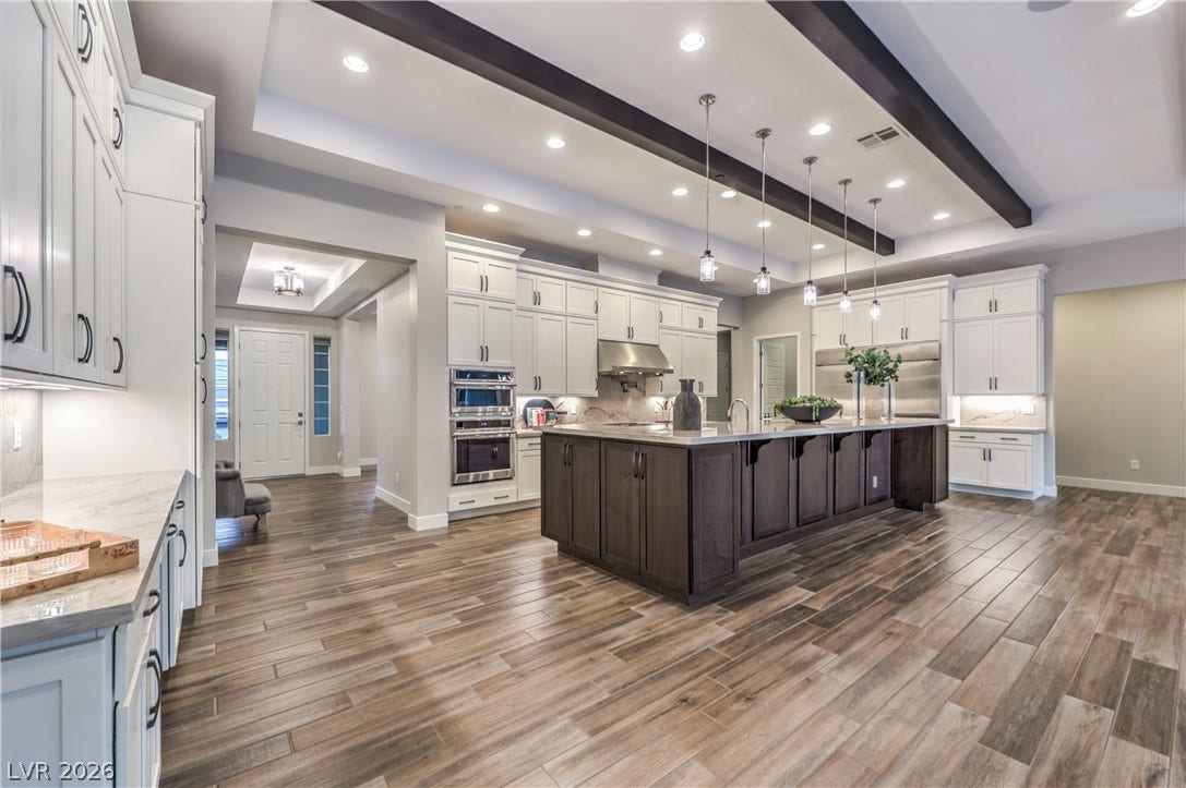 5455 Grambley Street, Las Vegas, NV 89149 Amazing, oversized kitchen island, top of the like appliances, double stacked cabinets, undercabinet lighting
