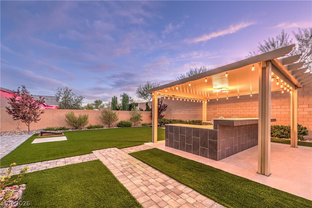 5455 Grambley Street, Las Vegas, NV 89149 Outdoor kitchen area with space designed for games, corn hole & entertaining