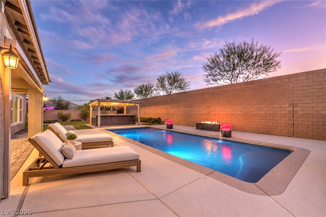 5455 Grambley Street, Las Vegas, NV 89149 Gorgeous pool with lite water bowls, fire pit and outdoor kitchen