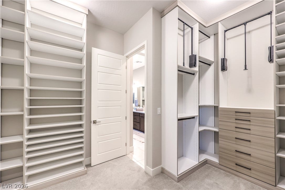 5455 Grambley Street, Las Vegas, NV 89149 Custom walk-in closets with built-in shelving, hanging space and drawer storage designed to keep everything organized and easy to access