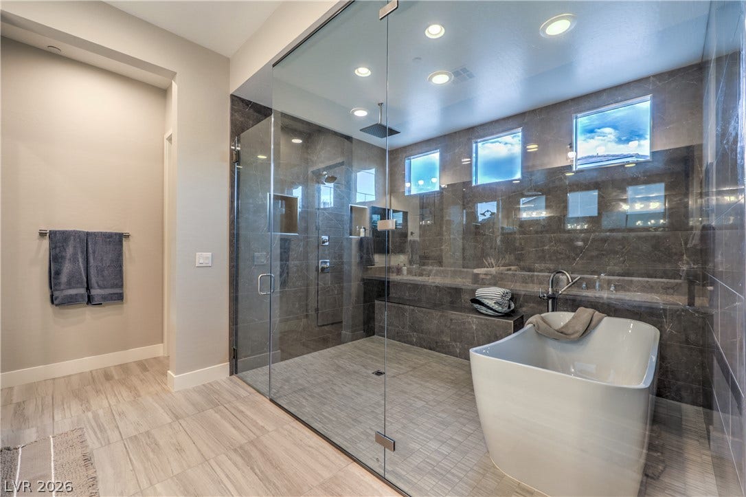 5455 Grambley Street, Las Vegas, NV 89149 Amazing custom primary bath with freestanding tub in shower with dual shower heads in beautiful custom tile - floor to ceiling