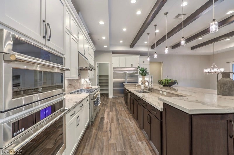 5455 Grambley Street, Las Vegas, NV 89149 Beamed ceiling and recessed lighting adds extra elegance to this gourmet kitchen