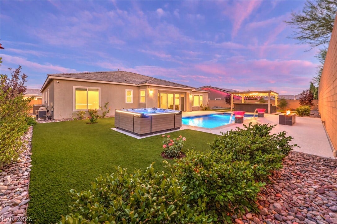 5455 Grambley Street, Las Vegas, NV 89149 Large backyard with pool, spa, outdoor kitchen, fire pit, large patio and side play yard. All turf and low maintenance