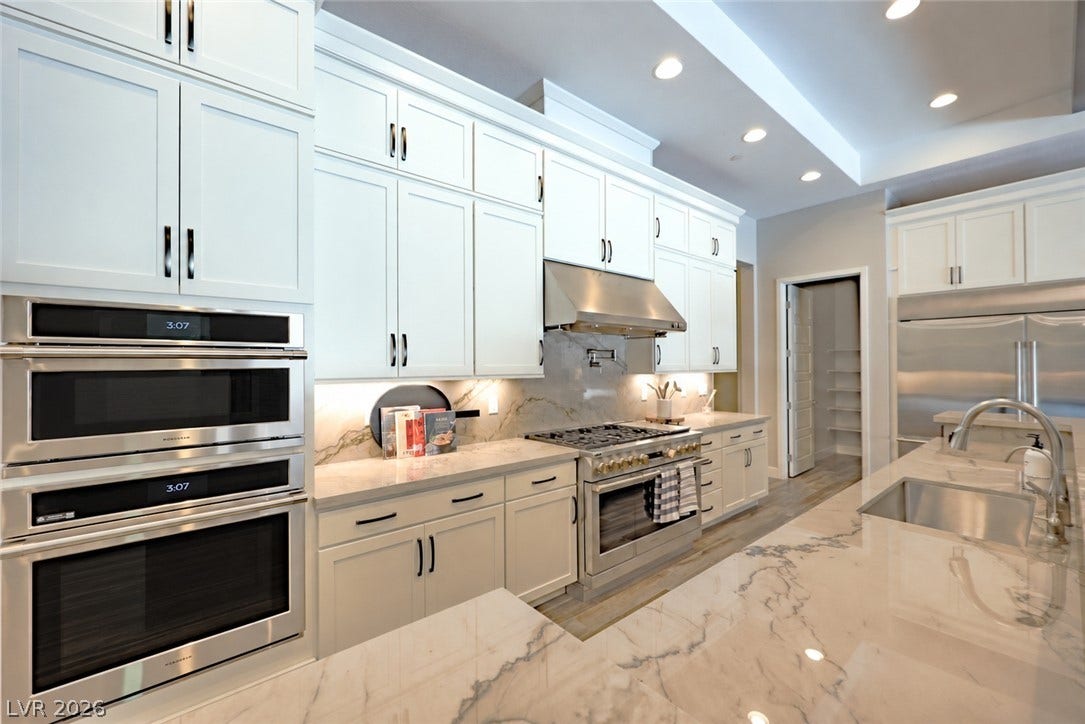 5455 Grambley Street, Las Vegas, NV 89149 Chiefs' kitchen with 3 ovens, 48 in gas range, 72 in stainless refrigerator & walk-in pantry