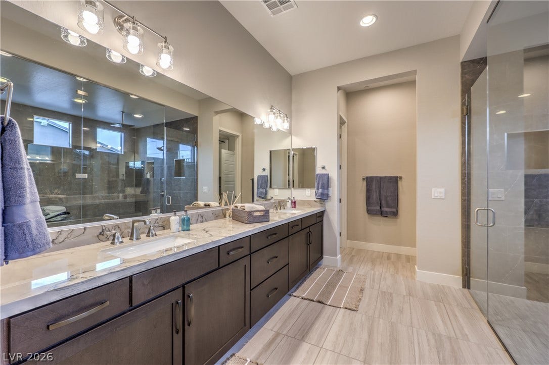 5455 Grambley Street, Las Vegas, NV 89149 High-end quartzite counters and 10-foot ceilings lead to two custom walk-in closets