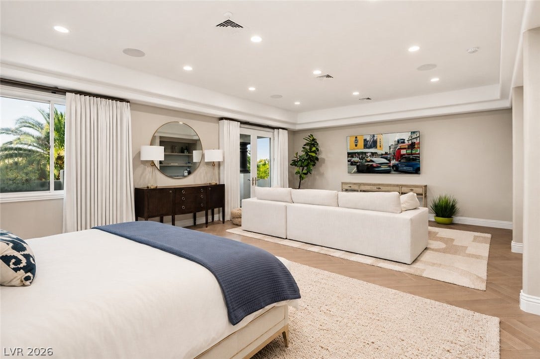 9817 Mountain Grove Court, Las Vegas, NV 89134 Gleaming wood floors in a chevron pattern anchor this expansive principal bedroom suite.
