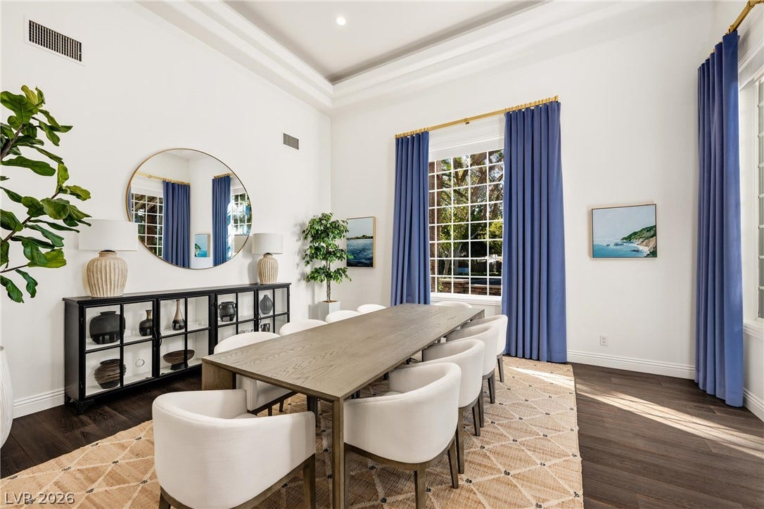9817 Mountain Grove Court, Las Vegas, NV 89134 Gleaming hardwood floors and a tray ceiling define this elegant formal dining room.