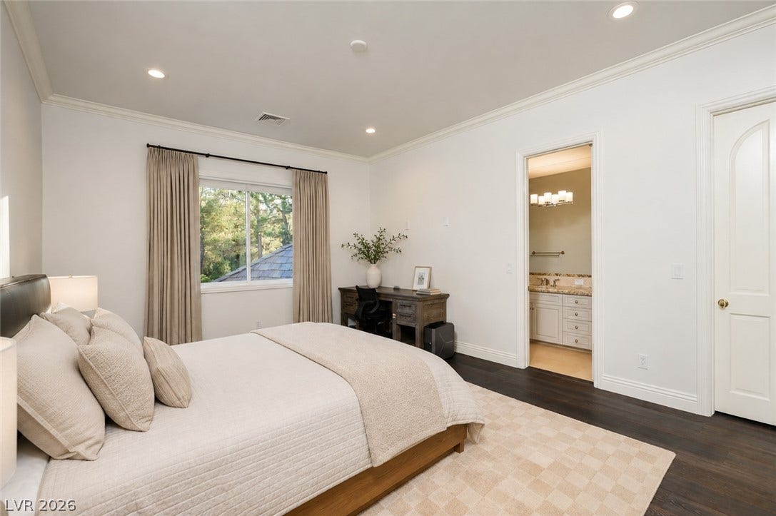 9817 Mountain Grove Court, Las Vegas, NV 89134 Rich hardwood flooring pairs beautifully with classic crown molding in this peaceful bedroom retreat.