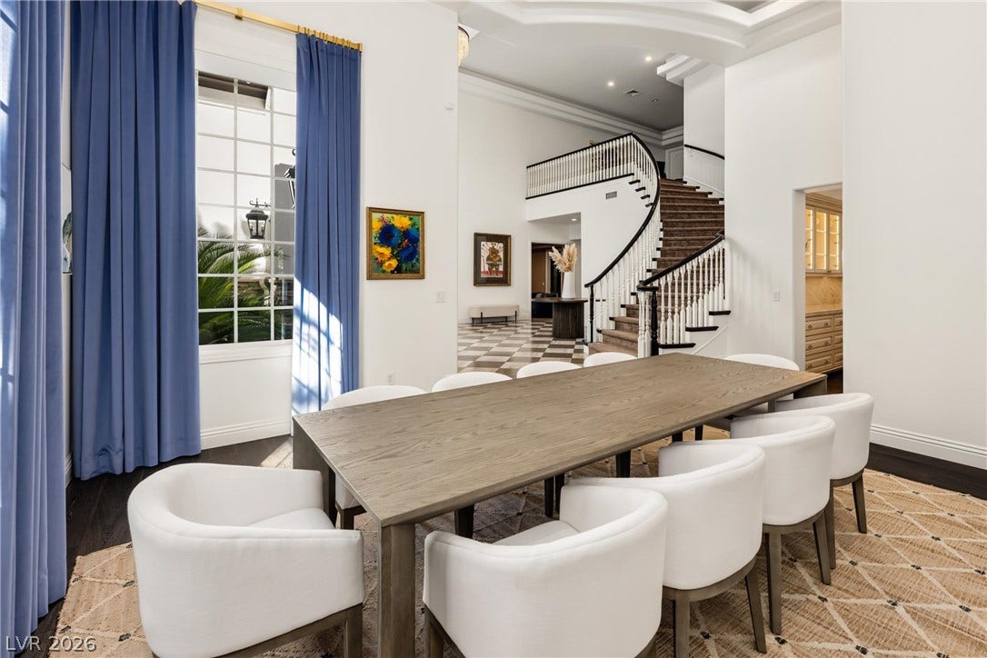 9817 Mountain Grove Court, Las Vegas, NV 89134 High ceilings and a curved staircase enhance the spacious dining room.