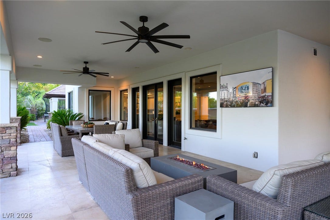9817 Mountain Grove Court, Las Vegas, NV 89134 An inviting covered patio offers tiled flooring and glass doors opening to the interior.