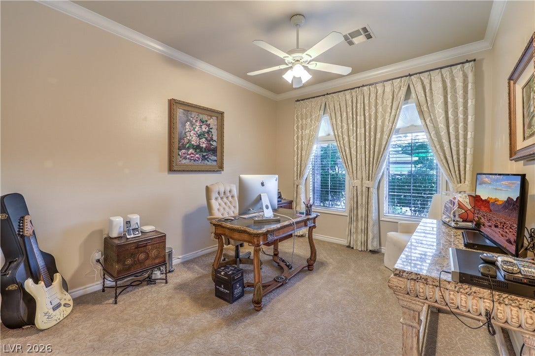 24 CROSS RIDGE Street, Las Vegas, NV 89135 Crown molding and plush carpeting define this versatile home workspace with generous natural light.
