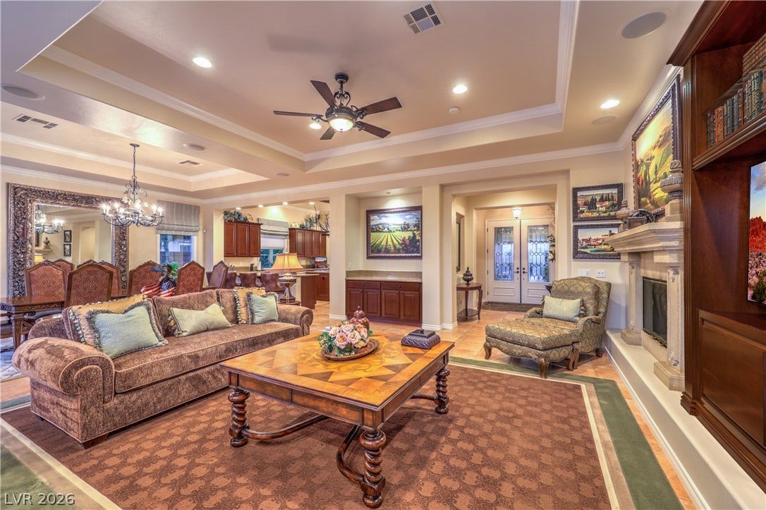 24 CROSS RIDGE Street, Las Vegas, NV 89135 An open floorplan integrates the living areas beneath elegant tray ceilings with recessed lighting.