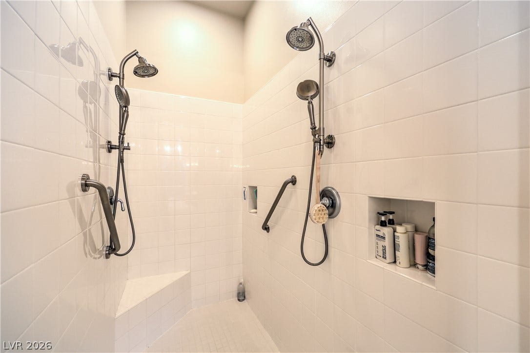 24 CROSS RIDGE Street, Las Vegas, NV 89135 A spacious walk-in shower is lined with classic white subway tile.
