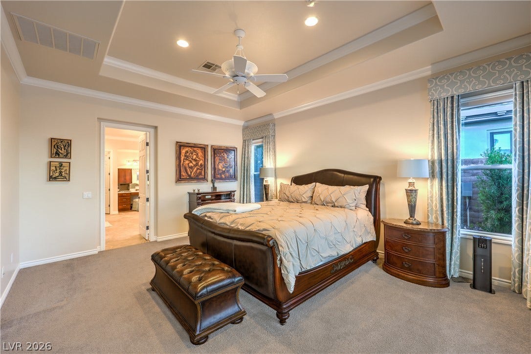 24 CROSS RIDGE Street, Las Vegas, NV 89135 A tray ceiling pairs with soft carpeting in this elegant, spacious bedroom sanctuary.