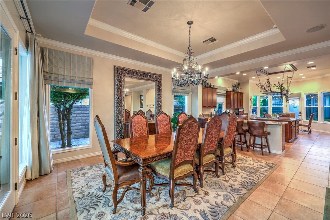 24 CROSS RIDGE Street, Las Vegas, NV 89135 Elegant tile flooring complements a detailed double tray ceiling and matching crown molding.