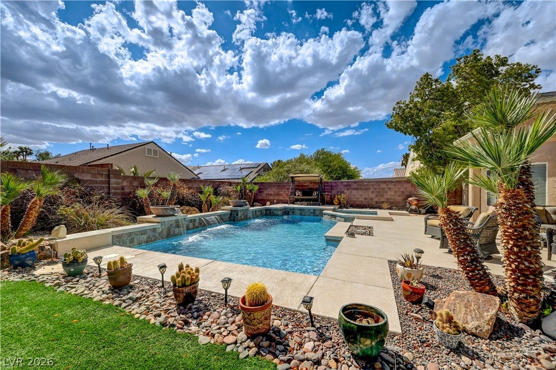 2201 Double Tree Avenue, Henderson, NV 89052 A sparkling swimming pool anchors this private backyard oasis framed by low-maintenance desert landscaping.