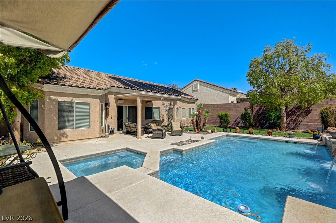 2201 Double Tree Avenue, Henderson, NV 89052 A terracotta tile roof accents this single-story home overlooking an inviting pool and spa.