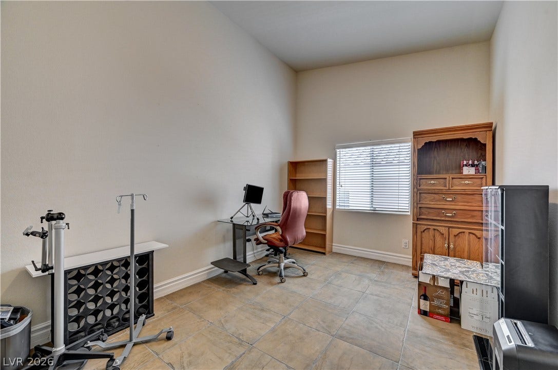 2201 Double Tree Avenue, Henderson, NV 89052 High ceilings and durable tile flooring highlight this versatile home office space.