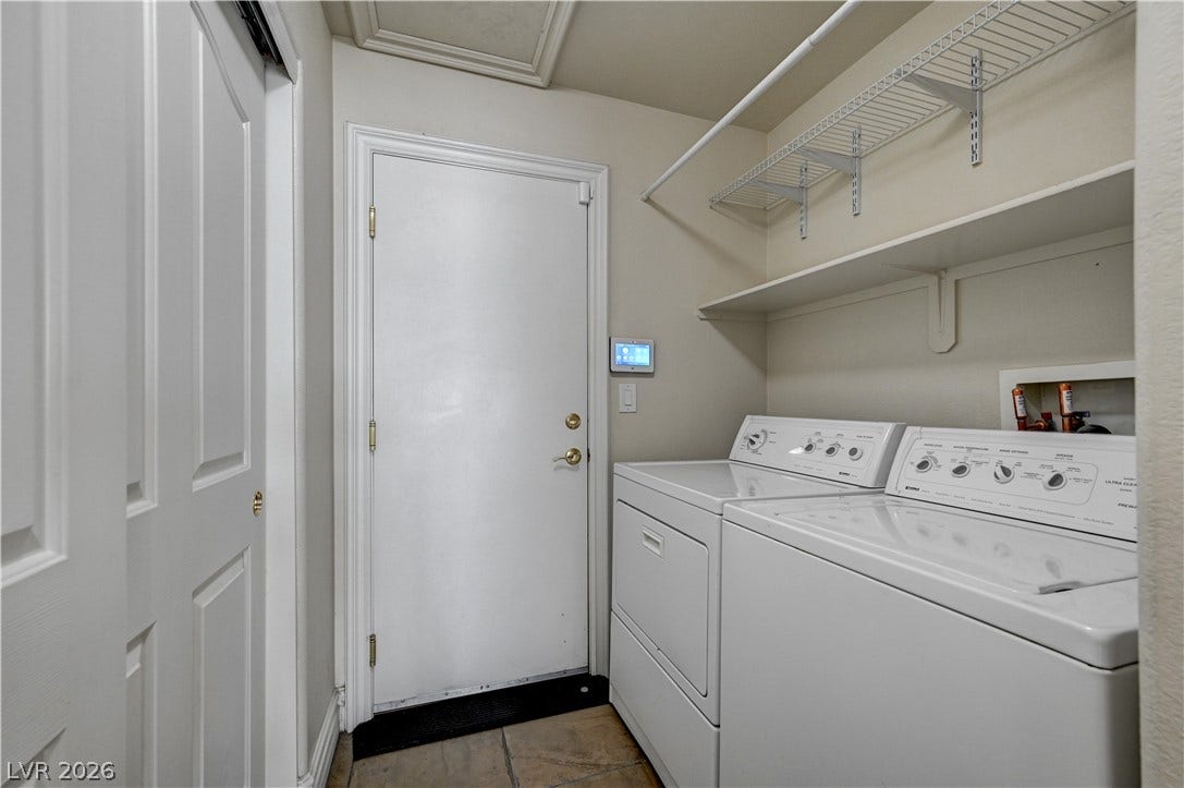 2201 Double Tree Avenue, Henderson, NV 89052 Functional tile flooring and built-in shelving maximize organization in this dedicated utility space.