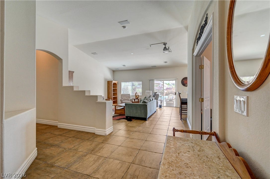 2201 Double Tree Avenue, Henderson, NV 89052 Tiled flooring and high ceilings define this welcoming entry that transitions to the living spaces.