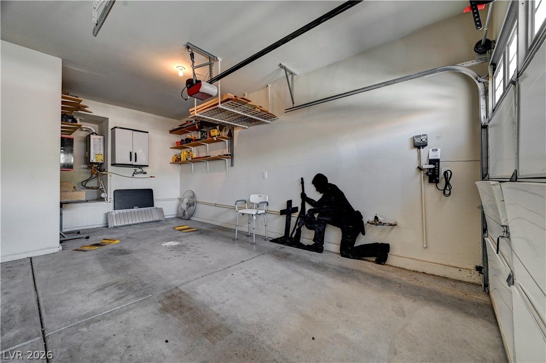 2201 Double Tree Avenue, Henderson, NV 89052 Concrete flooring and built-in shelving define this functional storage space.