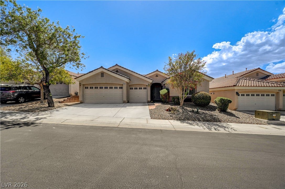 2201 Double Tree Avenue, Henderson, NV 89052 An inviting exterior displays neat low-maintenance landscaping and a classic tile roof design.