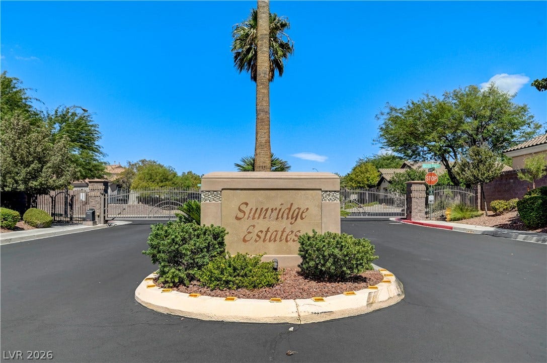 2201 Double Tree Avenue, Henderson, NV 89052 An inviting gated entrance welcomes residents to a beautifully landscaped neighborhood community.