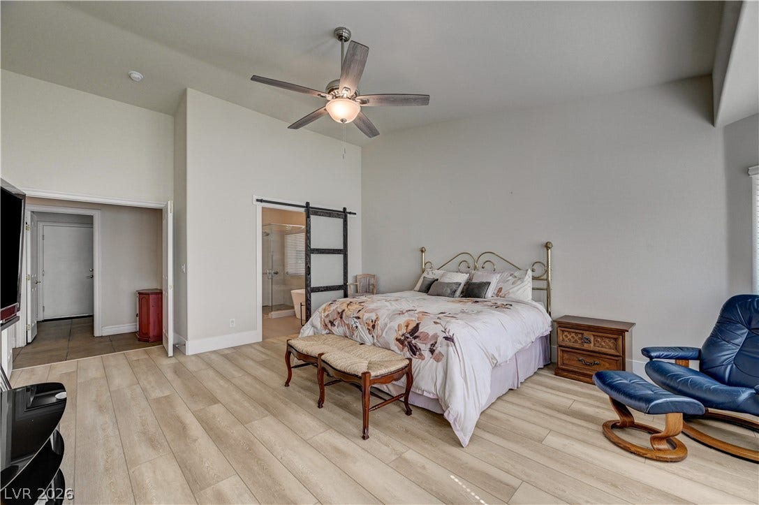 2201 Double Tree Avenue, Henderson, NV 89052 Smooth wood floors and vaulted ceilings create an open atmosphere in this main bedroom.