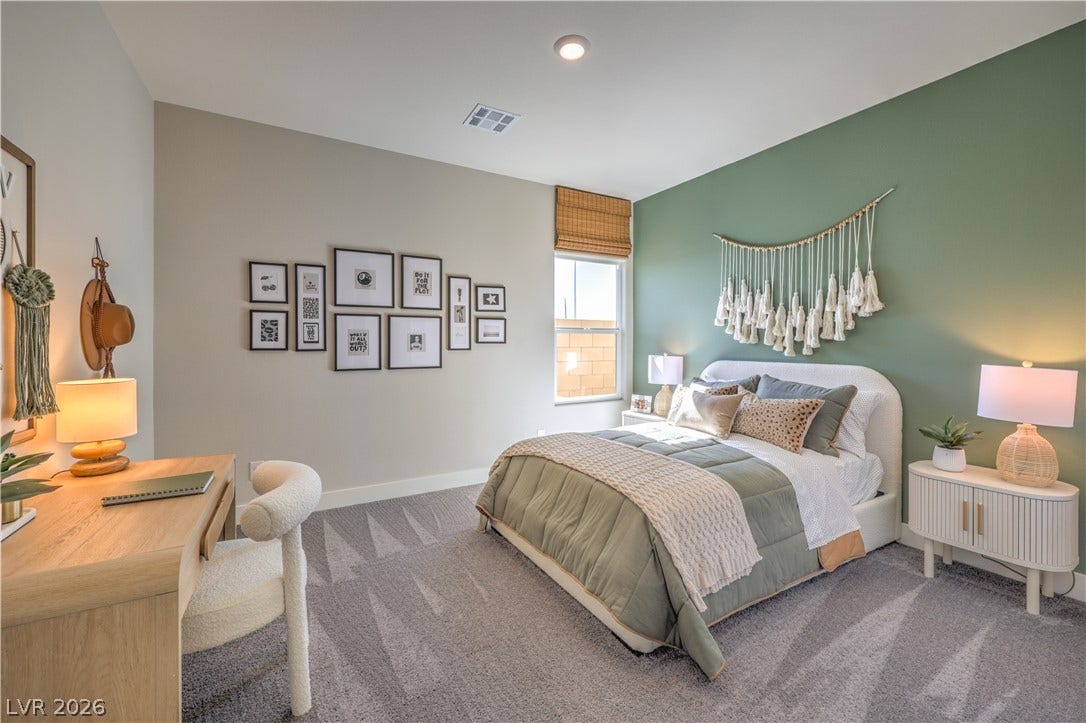 1032 Gentle Swan Street, Henderson, NV 89011 Recessed lighting and soft carpet create a comfortable atmosphere in this modern bedroom.