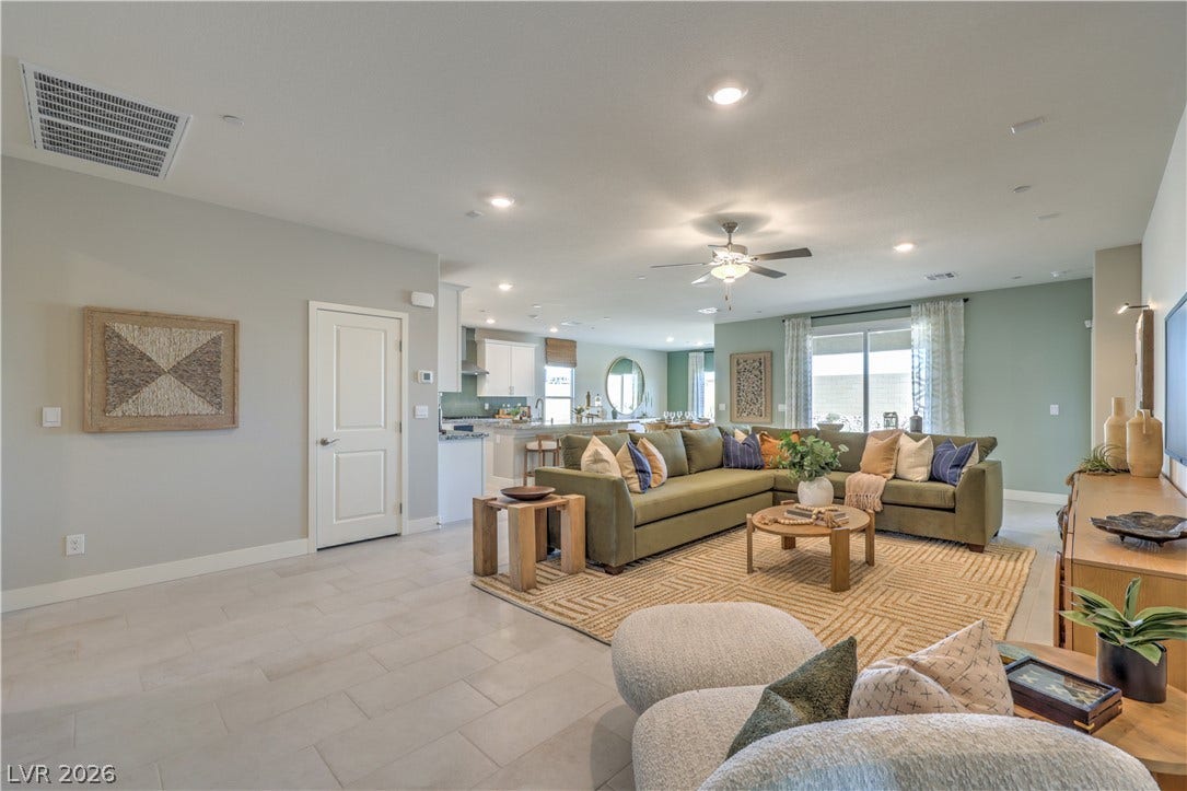 1032 Gentle Swan Street, Henderson, NV 89011 An open floor plan seamlessly connects the main living spaces over sleek tile flooring.