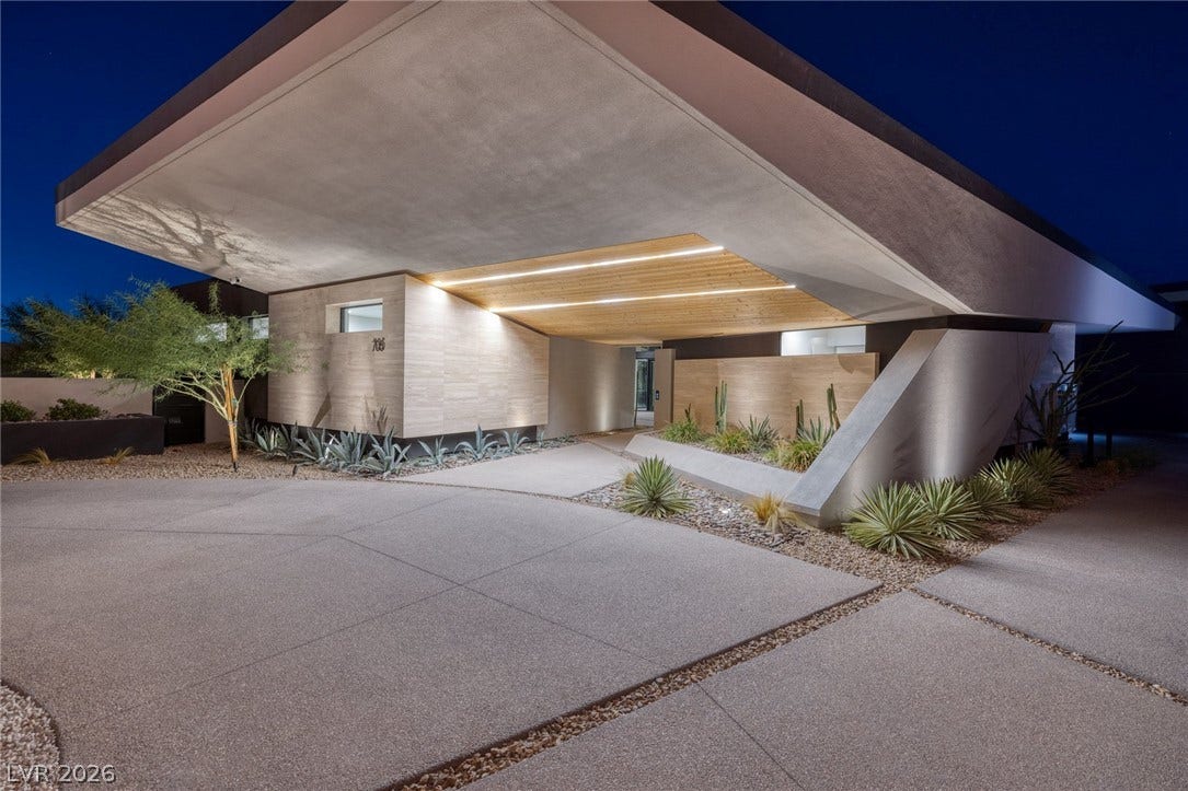 705 Dragon Peak Drive, Henderson, NV 89012 Bold geometric overhangs and custom architectural lighting define this striking modern desert entry.