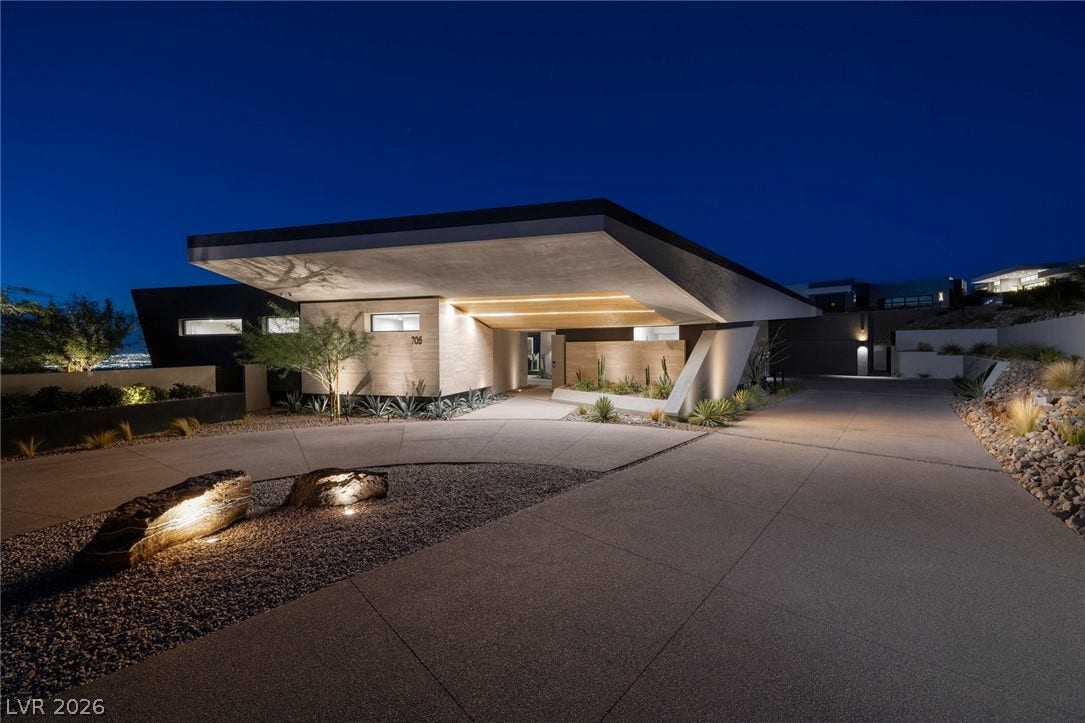705 Dragon Peak Drive, Henderson, NV 89012 Dramatic architectural lines and custom lighting define the entry of this modern desert estate.