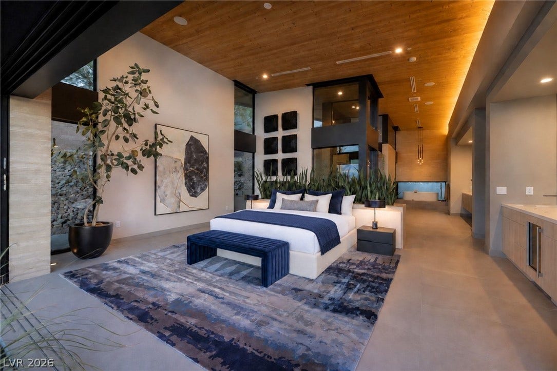 705 Dragon Peak Drive, Henderson, NV 89012 Warm wood ceilings and seamless outdoor integration define this contemporary master suite.
