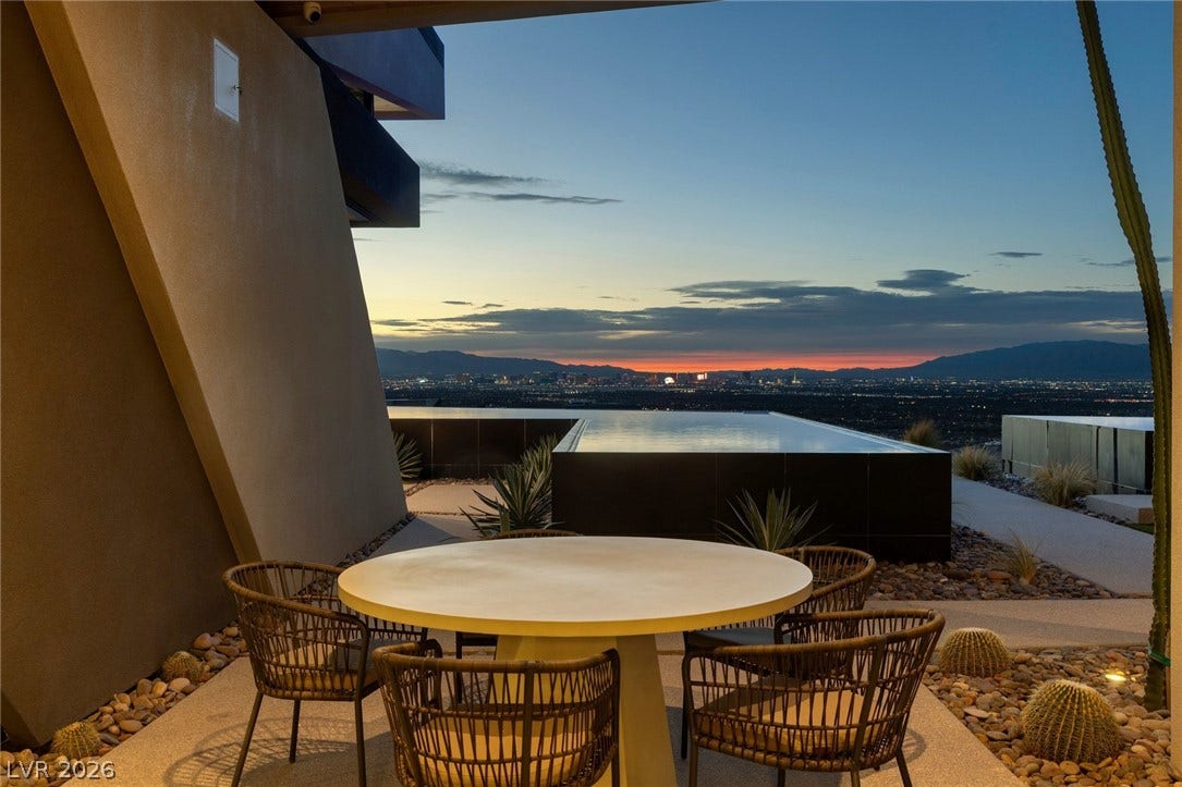 705 Dragon Peak Drive, Henderson, NV 89012 Panoramic city lights and distant mountains unfold from this elevated outdoor terrace.