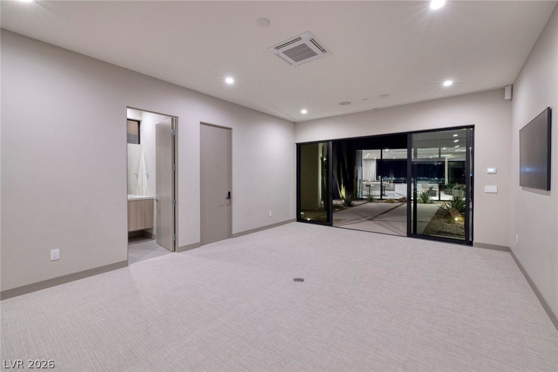 705 Dragon Peak Drive, Henderson, NV 89012 Sliding glass doors open from this versatile space directly onto the courtyard patio.