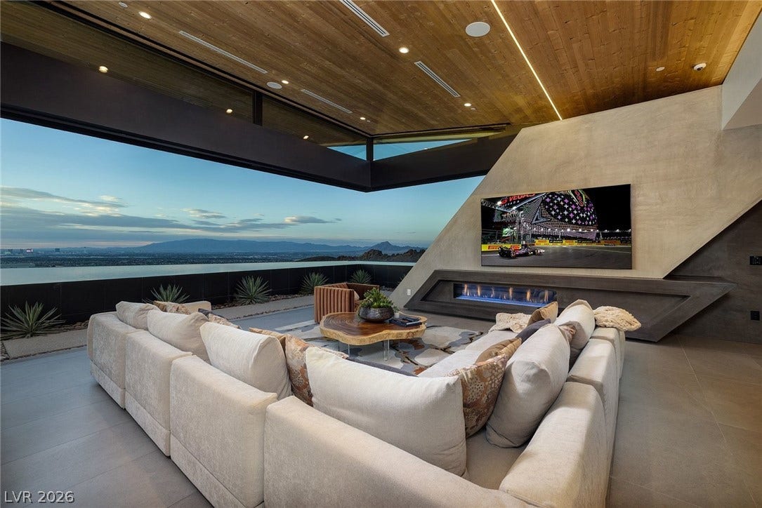 705 Dragon Peak Drive, Henderson, NV 89012 Dramatic architectural lines frame sweeping valley views through a retractable glass wall.
