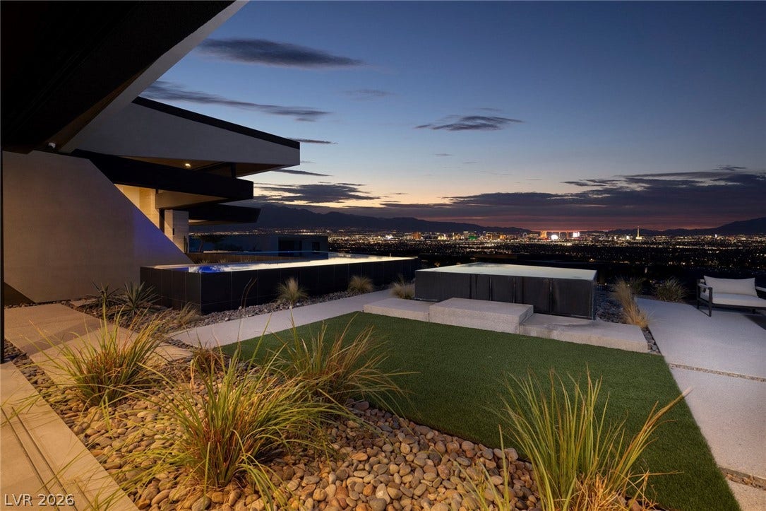 705 Dragon Peak Drive, Henderson, NV 89012 Gaze across the sparkling city skyline from this masterfully designed outdoor terrace.