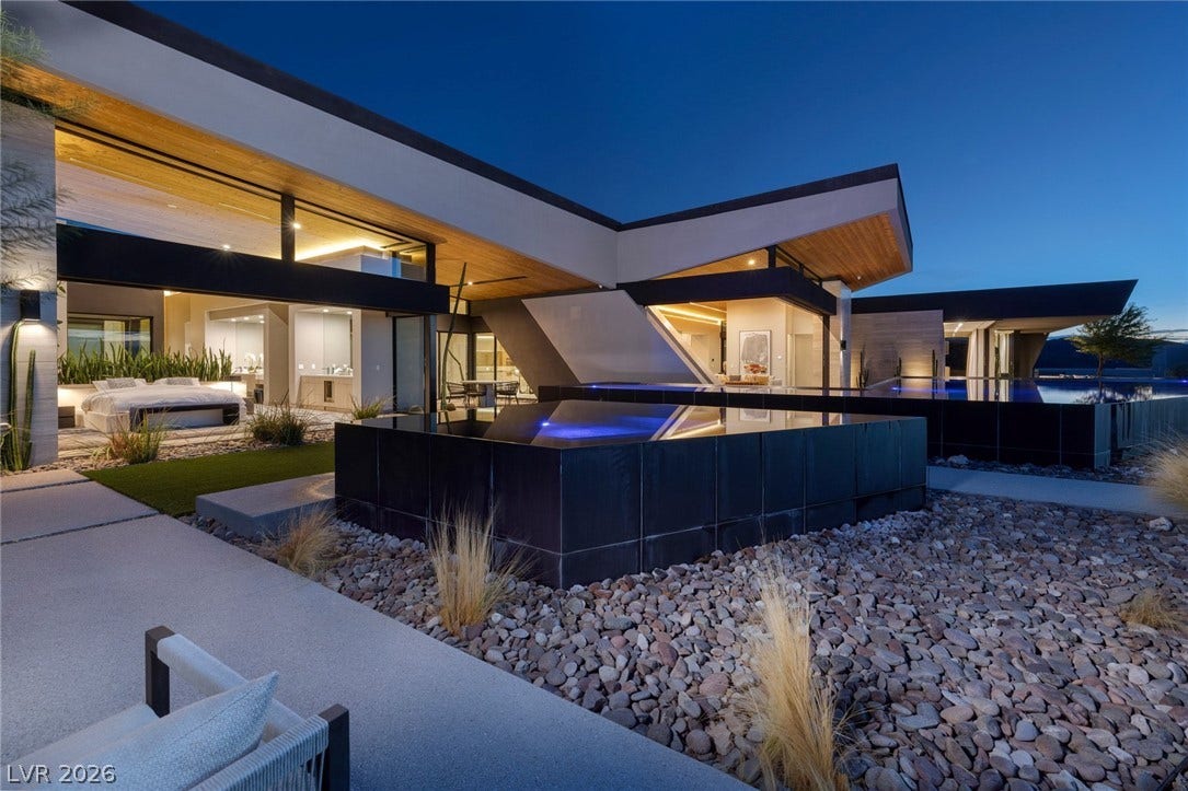 705 Dragon Peak Drive, Henderson, NV 89012 Dramatic modern angles and extensive glass panels define this striking architectural masterpiece.