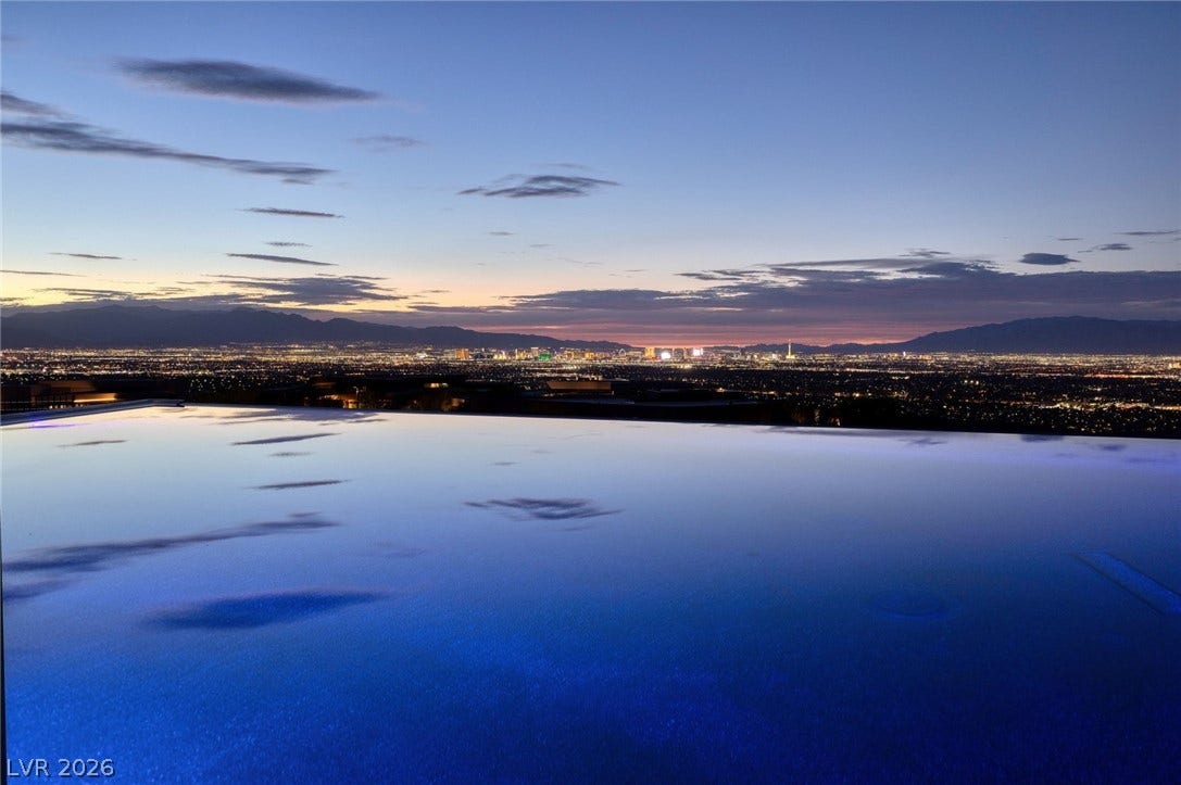705 Dragon Peak Drive, Henderson, NV 89012 Panoramic city lights and distant mountains unfold from the edge of this infinity pool.