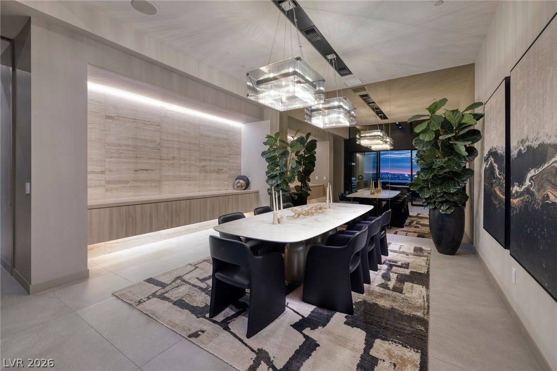 705 Dragon Peak Drive, Henderson, NV 89012 Gleaming tile floors and built-in alcove lighting define this refined dining space.