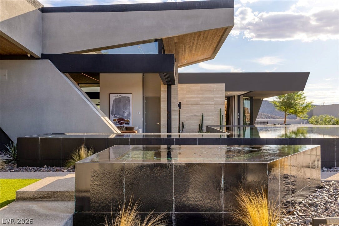 705 Dragon Peak Drive, Henderson, NV 89012 Bold geometric rooflines frame a custom pool and spa in this architectural desert estate.