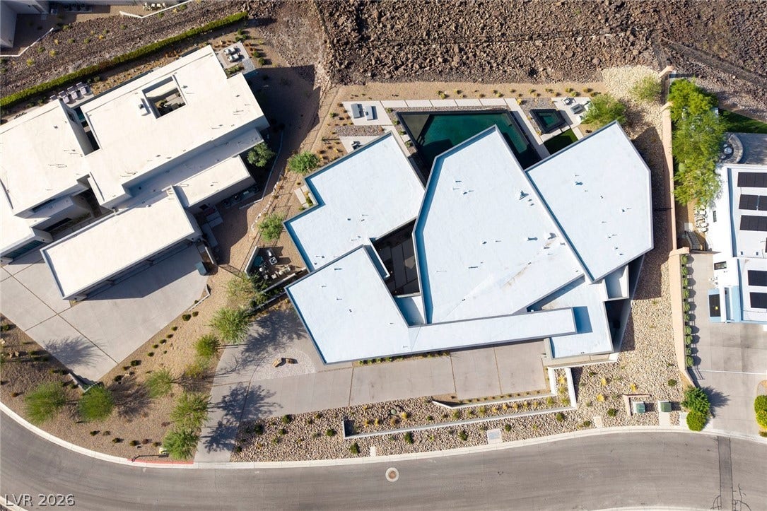 705 Dragon Peak Drive, Henderson, NV 89012 An overhead perspective highlights the striking angular rooflines and integrated backyard swimming pool.