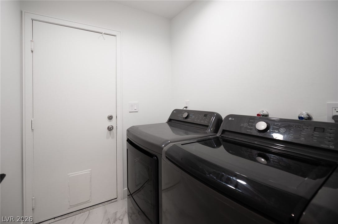 3139 Regal Oak Drive, Henderson, NV 89014 A functional laundry space highlights modern appliances and durable tile flooring.