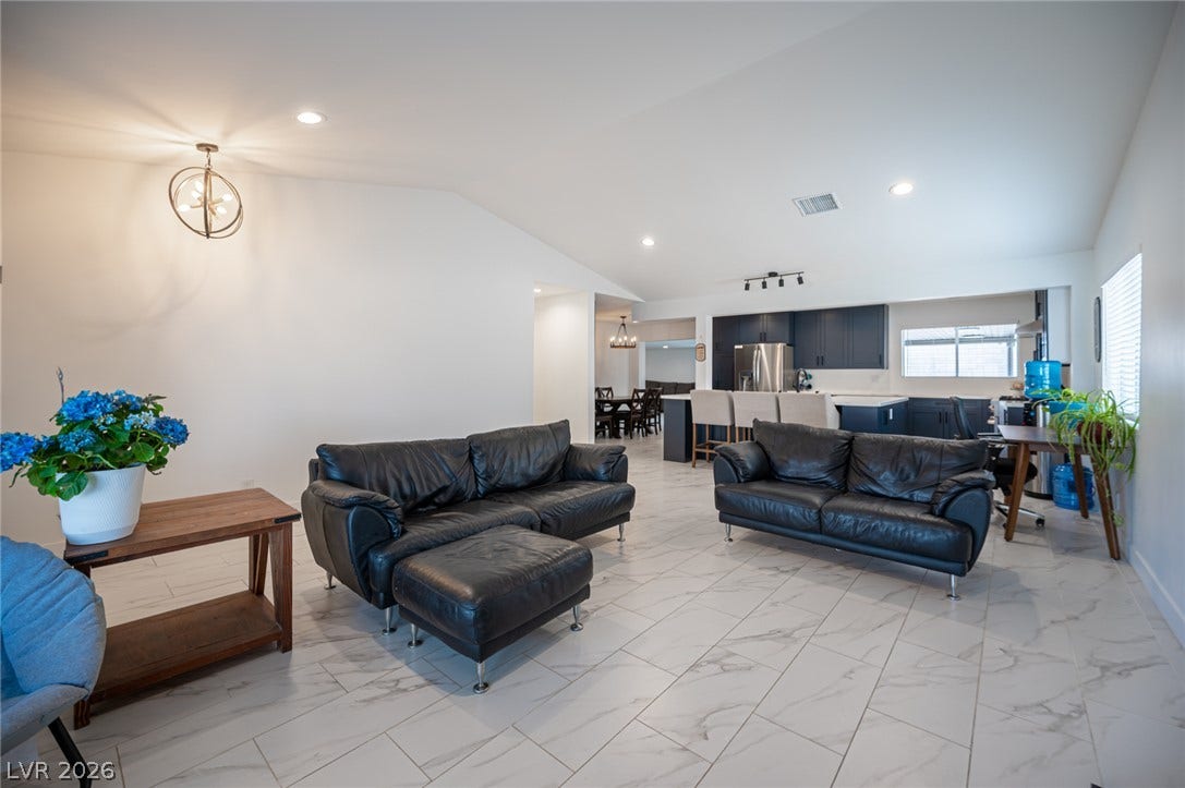 3139 Regal Oak Drive, Henderson, NV 89014 Gleaming tile floors and vaulted ceilings define this airy, open-concept living space.