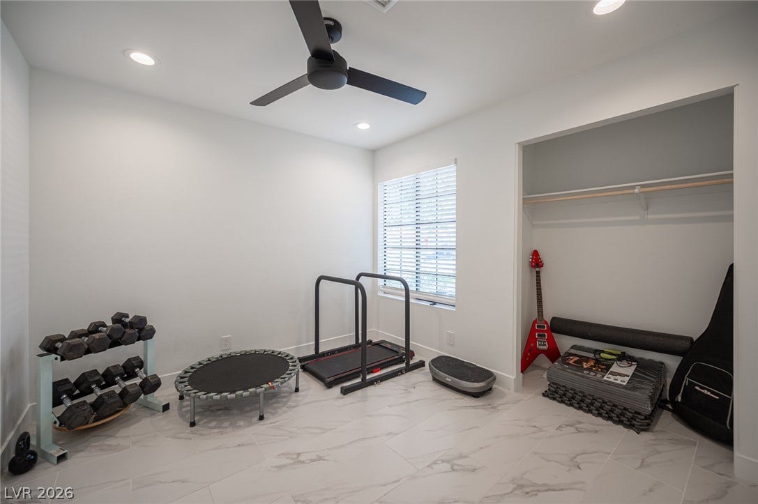 3139 Regal Oak Drive, Henderson, NV 89014 Gleaming tile flooring and clean lines define this versatile home gym space.