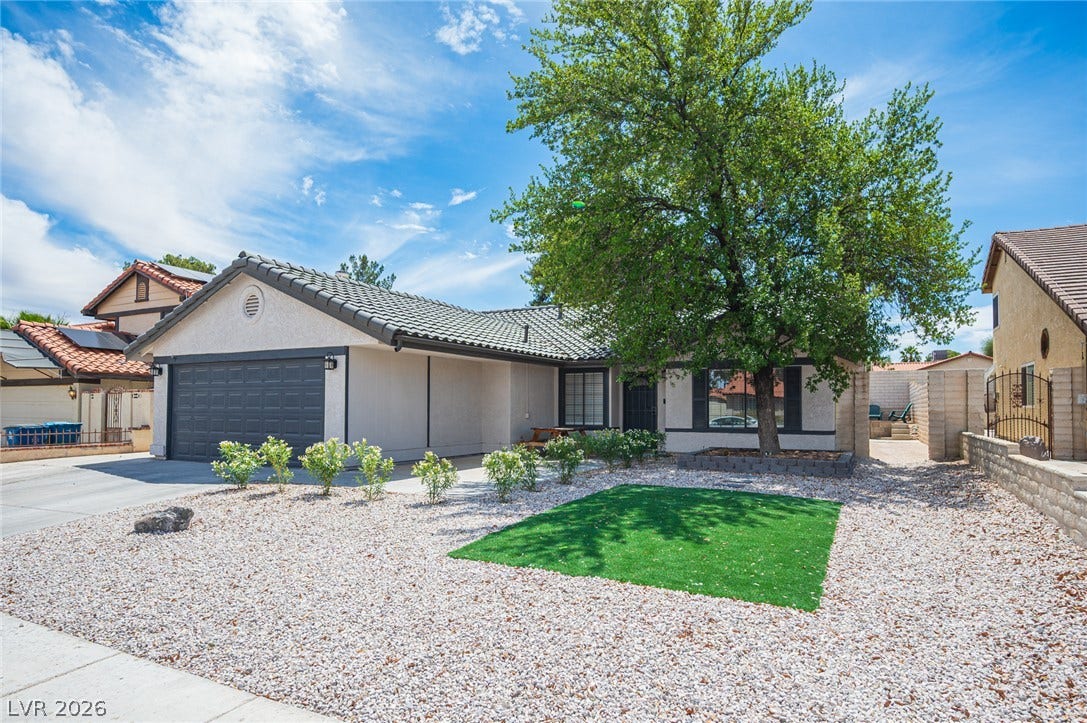 3139 Regal Oak Drive, Henderson, NV 89014 Low-maintenance desert landscaping frames the front facade of this single-story home with a tiled roof.