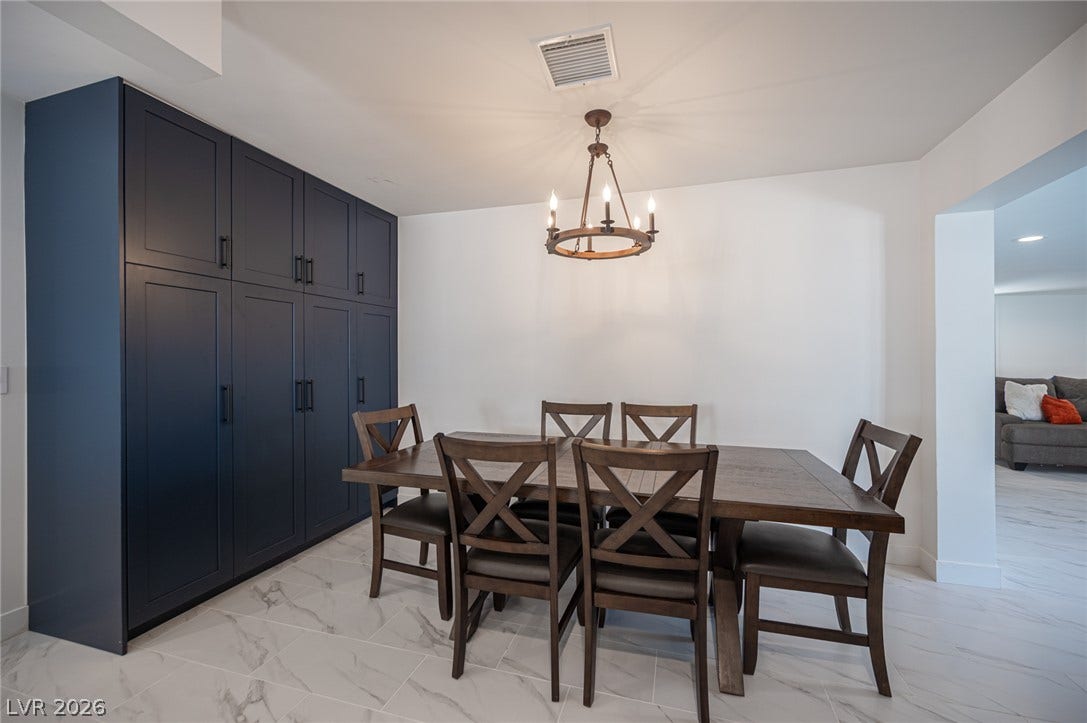3139 Regal Oak Drive, Henderson, NV 89014 Gleaming tile floors and custom built-in cabinetry define this elegant dining space.
