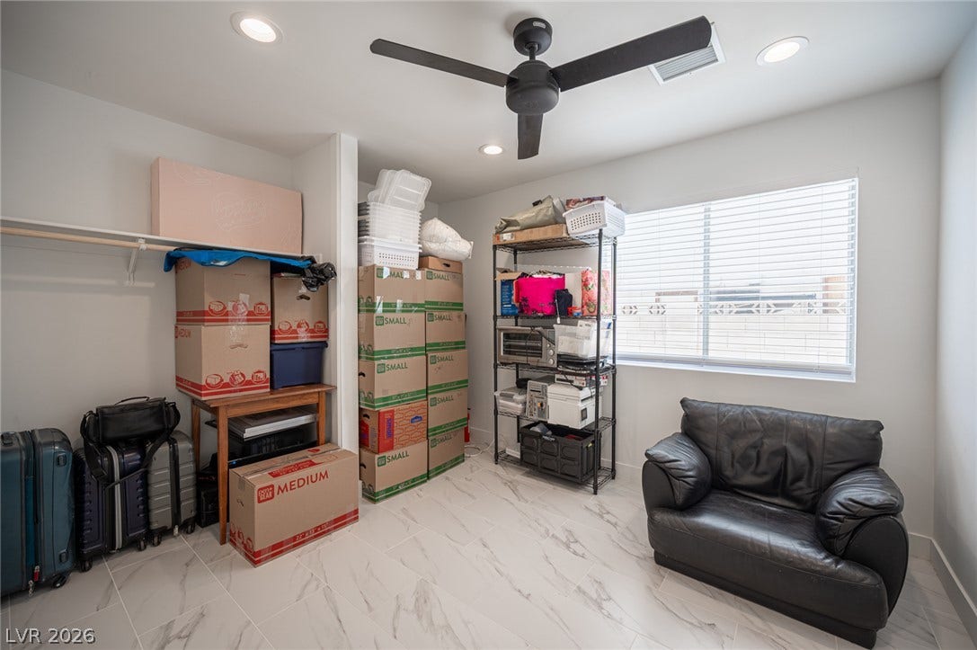 3139 Regal Oak Drive, Henderson, NV 89014 Gleaming tile floors and natural light from a large window define this versatile bonus space.